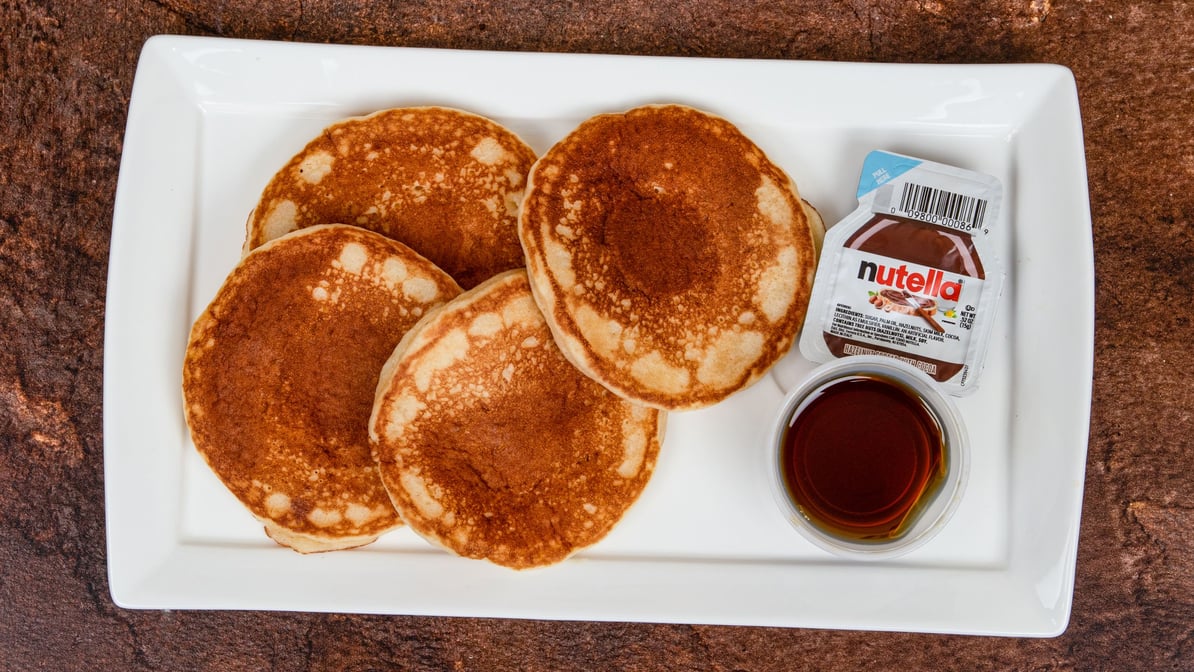 Sweet cafe breakfast served with illy style